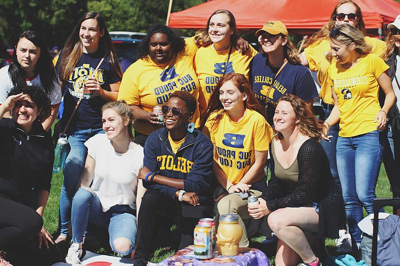 Members of Theta Pi Gamma tailgate at the Homecoming football game against Cornell College.